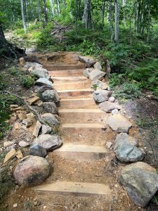 new staircase at Pine Cobble 2023 made from locust wood and stone