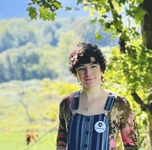 Woman satnding in front of landscape